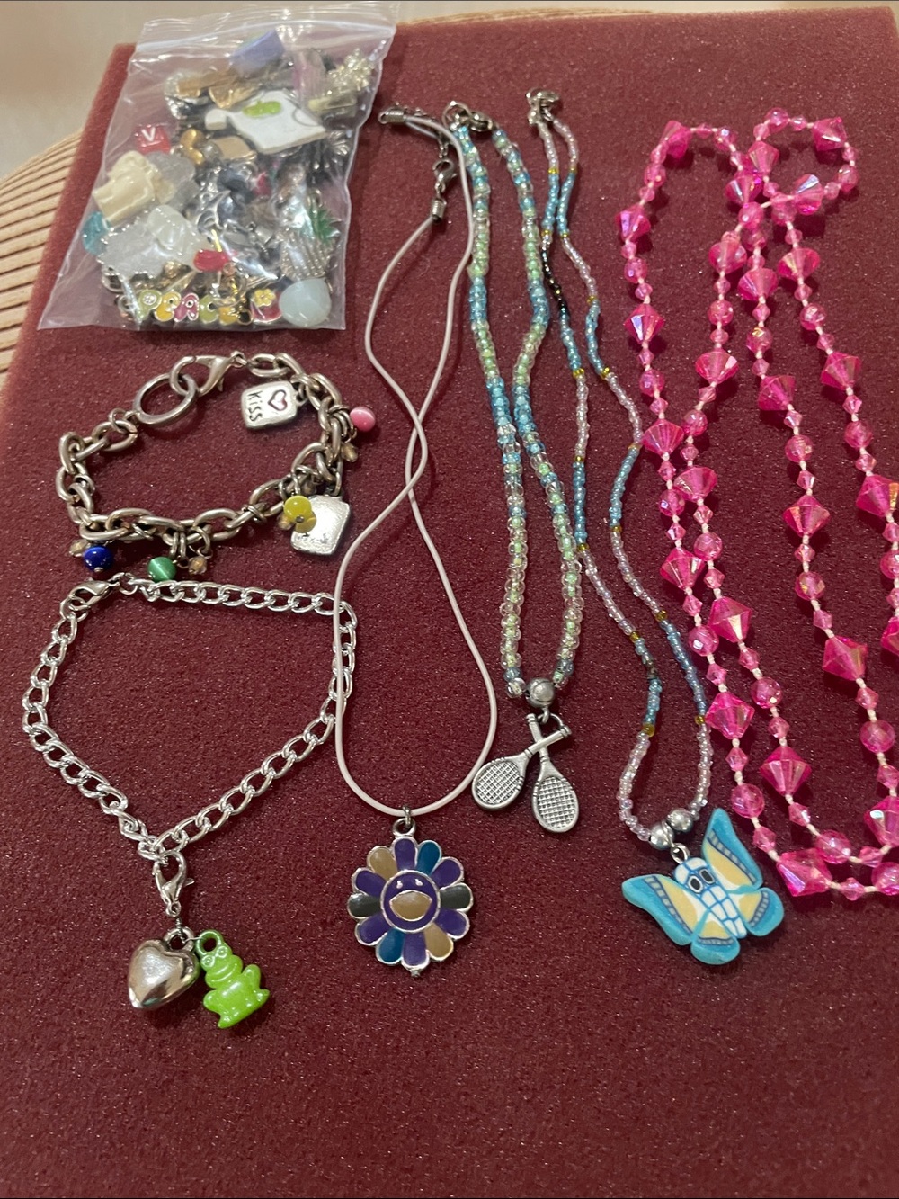 Girl’s 4 necklace, 2 charm bracelets,
Bag of charms. Great for crafting